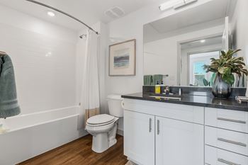 Bathroom with mirror, sink and toilet